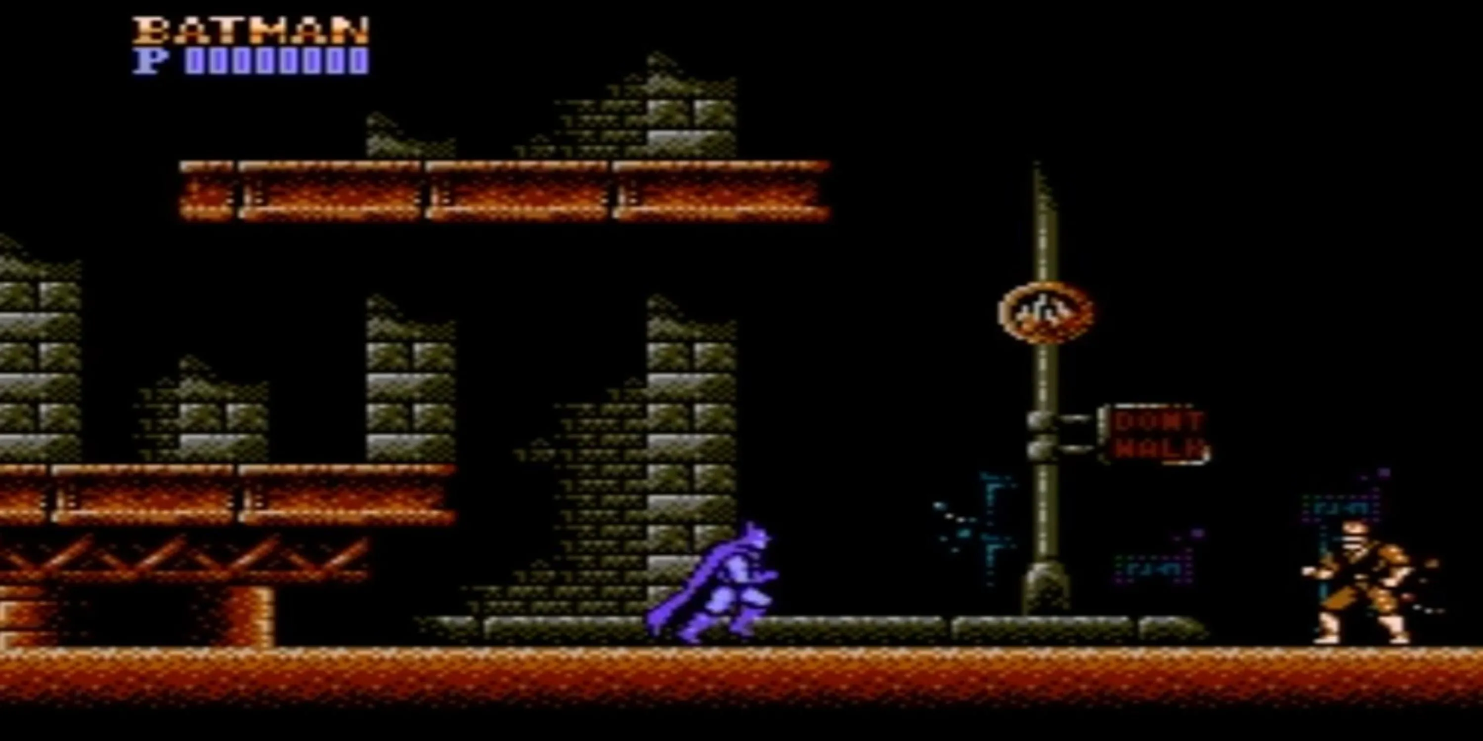 Batman nhảy tường chiến đấu với kẻ thù trong tựa game NES Batman kinh điển.