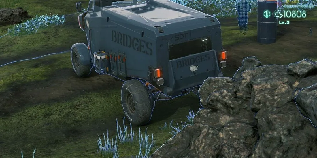 Chiếc xe tải đứng cạnh tảng đá lớn trong Death Stranding, thể hiện khả năng vượt địa hình