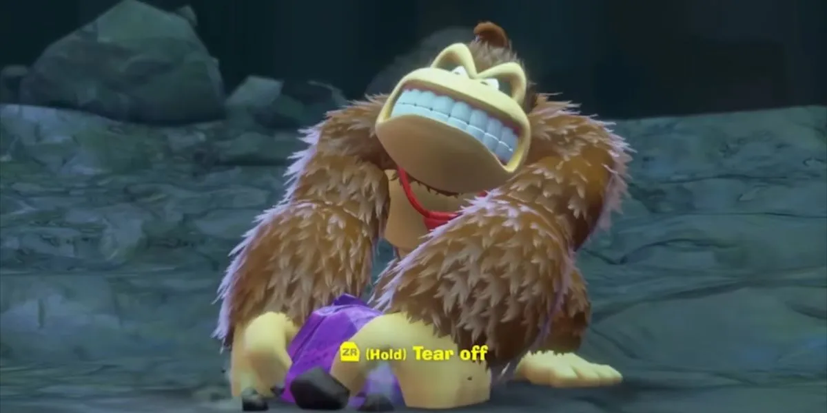 Donkey Kong đang xé một mảnh địa hình trong game, chuẩn bị sử dụng kỹ năng Tear Off Chunks đa dụng của mình