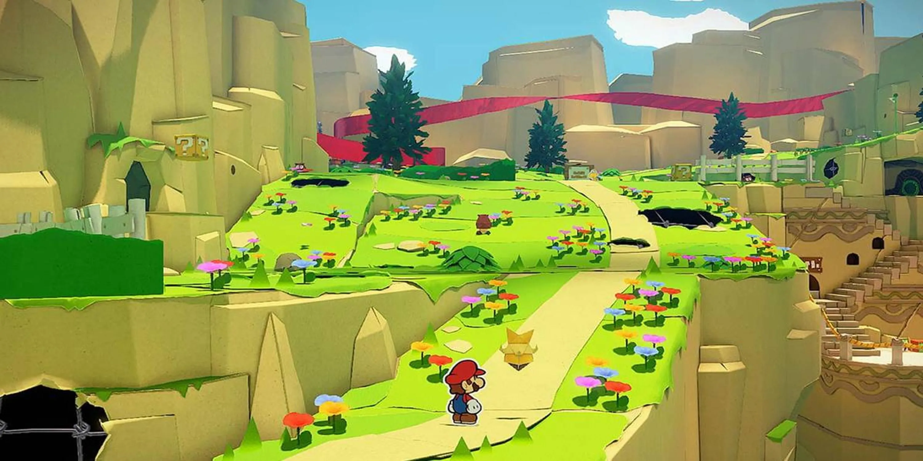 Mario giấy đứng trên con đường dẫn lên đồi trong Paper Mario The Origami King