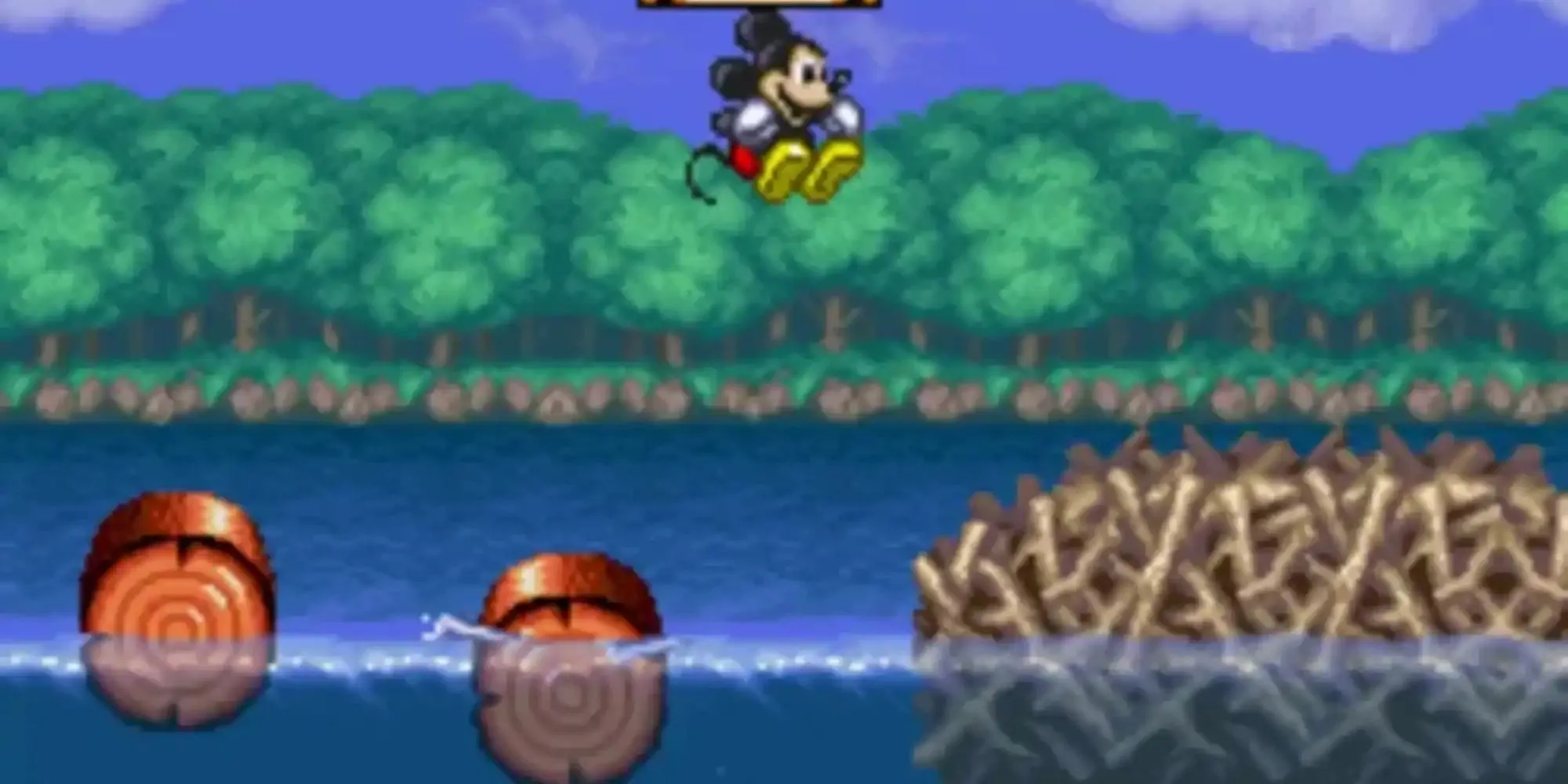 Mickey Mouse trong trang phục pháp sư sử dụng phép thuật trong game The Magical Quest cổ điển