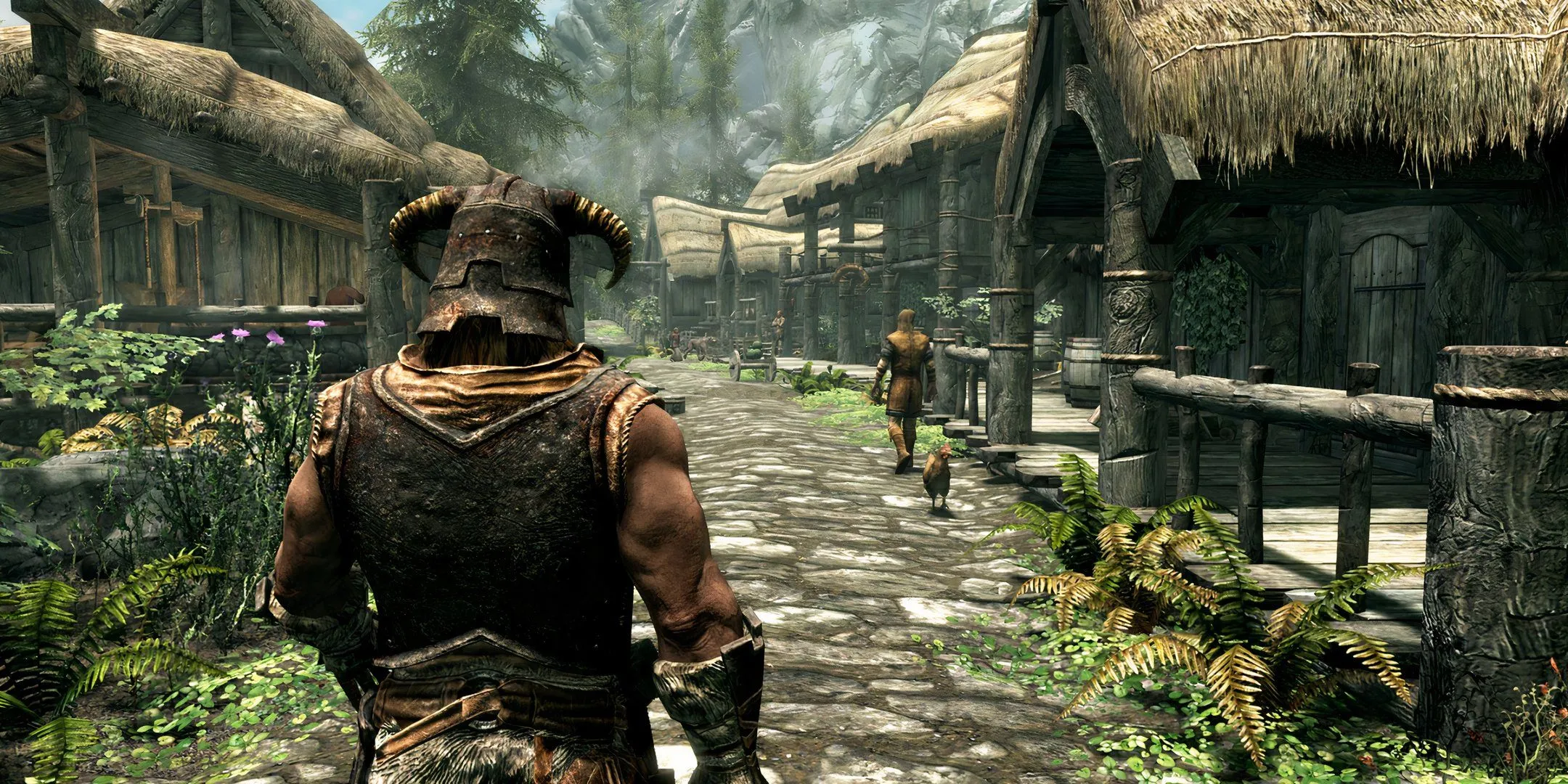 Nhân vật người chơi đang đi qua một thị trấn trong Skyrim, một game mà nhiều người chơi có thể chưa hoàn thành