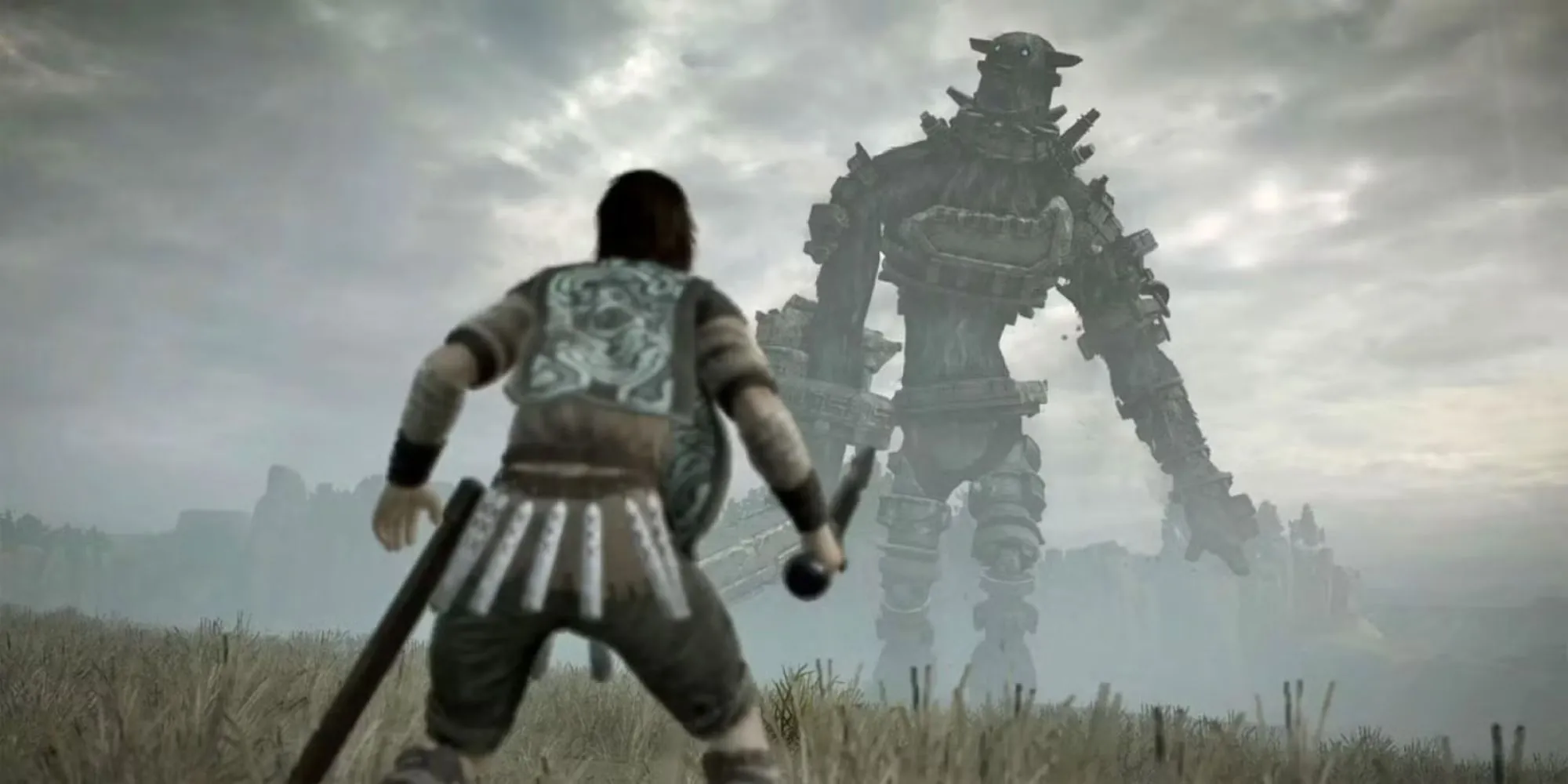 Wander đứng đối mặt với một Colossus khổng lồ giữa không gian hoang tàn trong tựa game kinh điển Shadow Of The Colossus